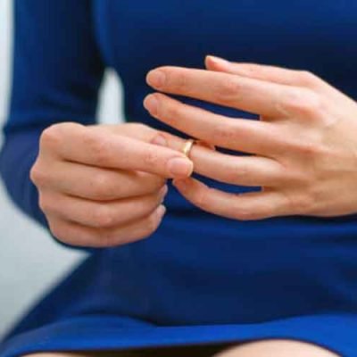 woman-in-dress-taking-off-ring