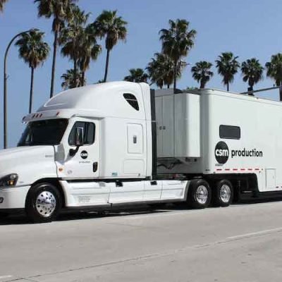 A-large-white-car-shipping-truck-on-the-road