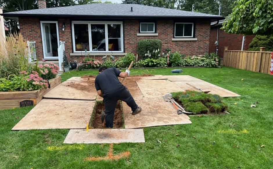 A-man-is-engaged-in-a-task-on-a-backyard-patio